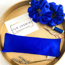 Load image into Gallery viewer, Blue Mulberry Silk Eye Pillow with blue silk scrunchies 

